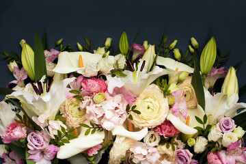 Summer blossoming delicate lilias and ranunculus on blooming flowers festive background, pastel and soft bouquet floral card, selective focus