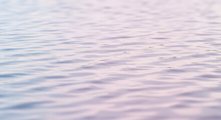 Gentle ripples on serene water surface, calm and tranquil abstract background, soft pastel hues.