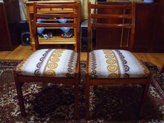 Vintage wooden chairs with patterned upholstery