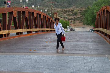 Black Model with Red Purse on Temecula Main Bridge