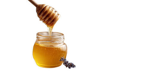 Golden honey dripping from dipper into glass jar with lavender sprig Sweet and natural honey concept for healthy lifestyle and alternative medicine