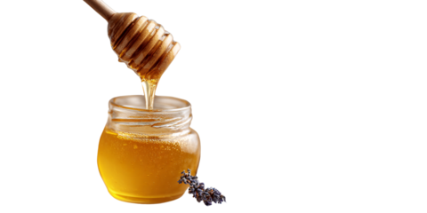 Golden honey dripping from dipper into glass jar with lavender sprig Sweet and natural honey concept for healthy lifestyle and alternative medicine