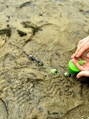 fisherman prepares bait on a feeder