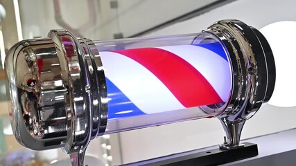Rotating barber pole sign illuminates a barbershop