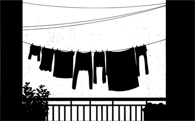 Silhouette of clothes hanging on a clothesline on a balcony with plants and railing viewed from below
