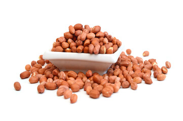 Dried peanuts in closeup on white