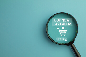 A magnifying glass is focused on a Buy Now Pay Later (BNPL) option. A concept for searching and finding BNPL deals, e-commerce payment methods, and online shopping services.,copyspace.