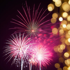 Fototapeta premium Spectacular Fireworks Display Illuminating the Night Sky with Vibrant Bursts of Color and Sparkling Lights, Creating a Festive Atmosphere for New Year's Eve