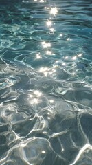 Obraz premium Sunlight dancing on clear water, creating shimmering reflections and fluid patterns