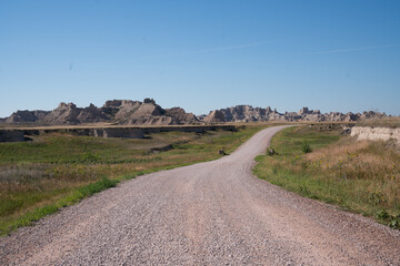 Curved gravel road through prairie in Badlands National Park, South Dakota