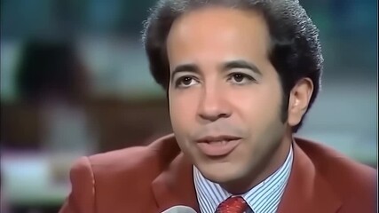 Retro male news anchor delivering breaking news with a confident smile, dressed in a stylish suit. The mood is engaging and informative, capturing a pivotal moment in broadcasting history.