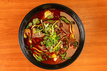 Szechuan beef and noodle soup