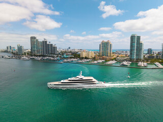 Naklejka premium Yachting and boating marina. Yacht boat sailing. Aerial view luxury motorboat in sea. Summer sea vacation. Boat trip. Luxury lifestyle and traveling. Sea boat go to yacht marina. Endless sea