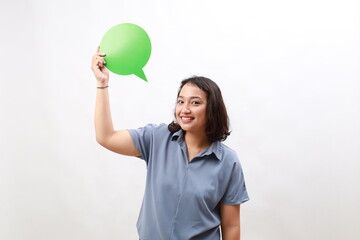 Young woman holding green speech bubble in front white background