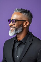 Fototapeta premium A man with timeless elegance and a natural smile. A smiling man in a professional portrait session. A glowing and peaceful man expressing warmth. A peaceful and radiant male in a confident pose.