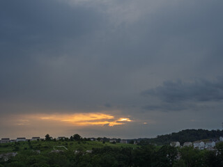 Twilight sky with a golden sunset over a Pennsylvania residential landscape