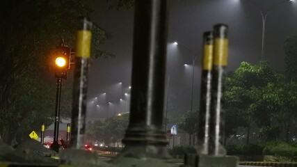 A yellow light flashing in a relatively quiet intersection to prevent accident because of speeding driver