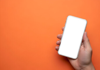 A person's hand holding a white smartphone with a blank screen, positioned on the right side of the frame. The background is a vibrant, solid orange.

