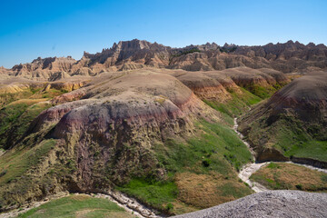 Colorful eroded hills and green vegetation in Badlands National Park, South Dakota