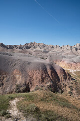 Colorful eroded hills and green vegetation in Badlands National Park, South Dakota