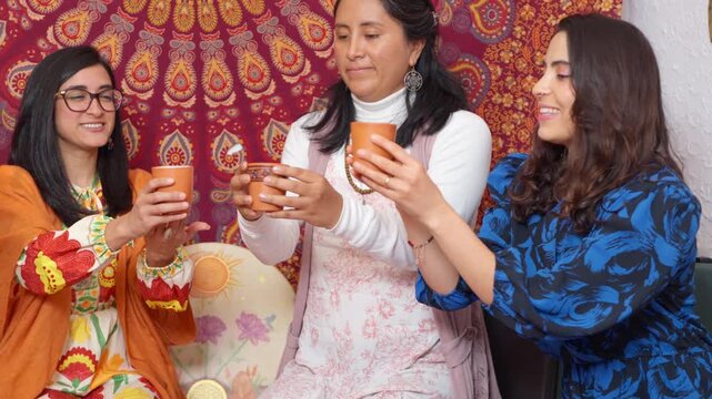 Women sharing cacao drink in spiritual ceremony