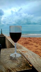  Glass of Red Wine on a Beach