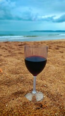  Glass of Red Wine on a Beach 