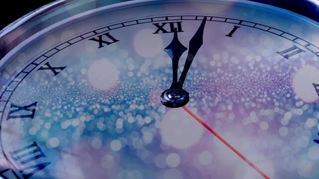  New Year's Eve Countdown Clock: Animation of a clock striking midnight with a festive sparkling glitter and bokeh background. Concept for celebration, party, and new beginnings.