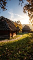 Fototapeta premium Autumnal village scene at sunrise