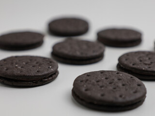 Black biscuits isolated on white background