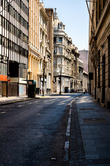 Empty cobblestone street in Valparaíso, Chile with historic architecture and morning sunlight. Travel concept.
