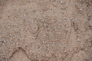Full frame shot of texture and surface of sand. Sand is a mixture of very small pieces of different rocks or minerals.