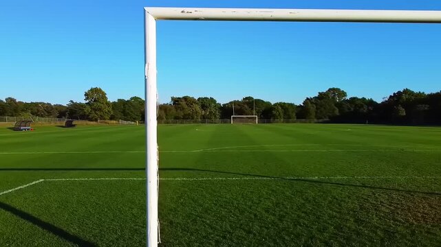 Soccer field goal with sunny day.
