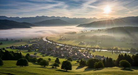 Obraz premium Enchanting Morning Mist Blankets a Serene Valley Village, Bathed in the Golden Glow of Sunrise, Evoking Peace and Natural Beauty