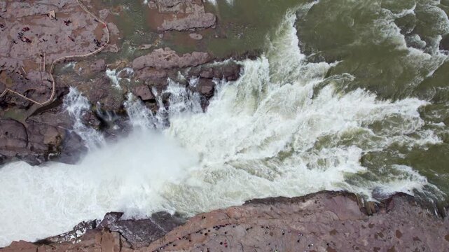 Drone view of Hukou Waterfall in Shanxi Province, China, it is a magnificent sight of the surging Yellow River water, filled with energy and awe inspiring，4k slow motion footage aerial view. 