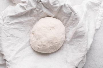 top view of homemade bread dough resting, process of making artisan bread