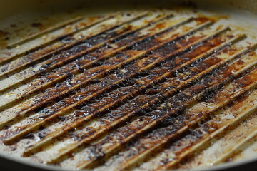 dirty white circle pan after cooking in home