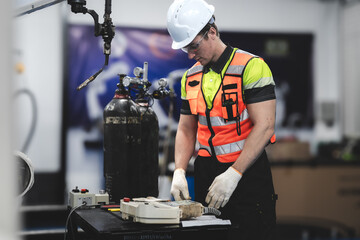 Smart Caucasian engineer work setup AI automated in robotics electronics engineering laboratory. Technician inspector maintenance repair check robot arm machine in artificial intelligent laboratory.