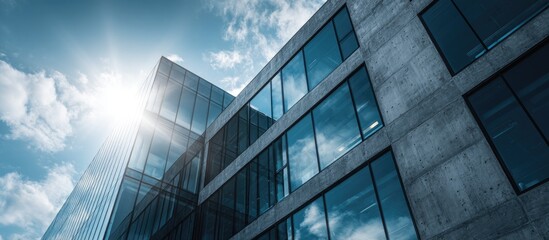 Obraz premium Modern office building facade under a partly cloudy sky