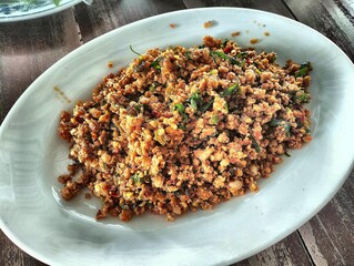 Authentic Thai Cooked Minced FIsh Salad  Served on White Plate