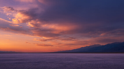 Naklejka premium background of mountains and open space of concrete ground under sunset