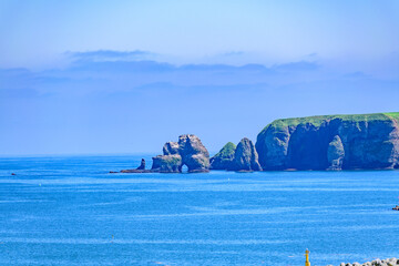 Naklejka premium Landscape of the Town, Sea, and Mountains in Ochiishi, Nemuro, Hokkaido, Japan 