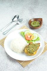 Green chili smashed fried chicken is a common and popular dish in Indonesia.