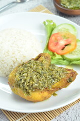 Green chili smashed fried chicken is a common and popular dish in Indonesia.