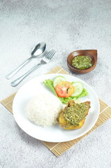 Green chili smashed fried chicken is a common and popular dish in Indonesia.