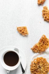 Overhead view of sassafa northern nigerian snack, top view of rosette cookies on a white countertop