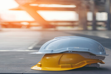 Obraz premium Construction hard hat vertical safety tools equipment workers in construction site engineering protection head on wood wall. Engineering Construction Vertical Many hard hat row helmet with copy space