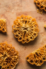 Overhead view of sassafa northern nigerian snack, top view of rosette cookies on a countertop	