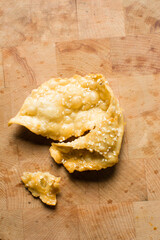 Overhead view of dublan northern nigerian snack, top view of dublan on a plate, flaky fried dough coated in syrup and sesame