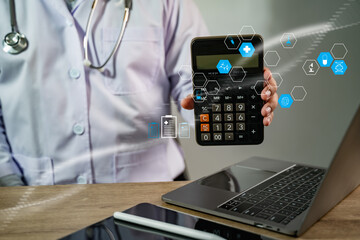 Medical cost calculation concept shown by a doctor holding a calculator with healthcare icons in a digital workspace, representing financial planning and expense analysis in the medical industry.